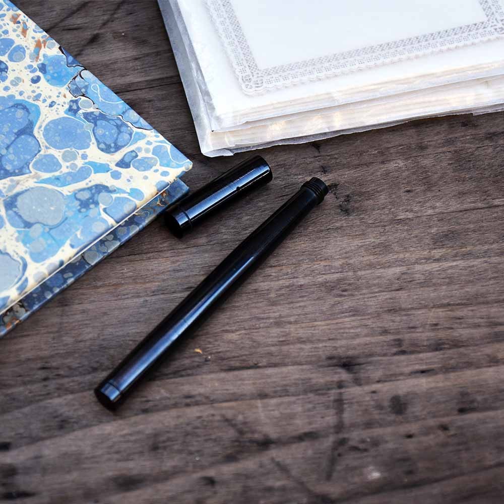 Safety fountain pen with retractable gold nib